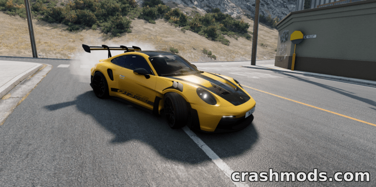 A sleek yellow Porsche 911 (992) drifts around a corner in BeamNG.drive, showcasing its dynamic mod features.