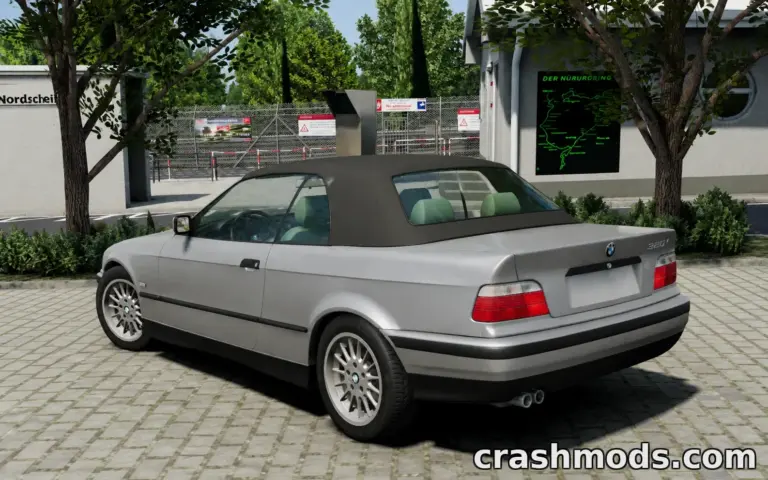 BMW E36 M3 REAMAP mod showcased in BeamNG.drive, featuring a sleek convertible parked in a detailed environment.