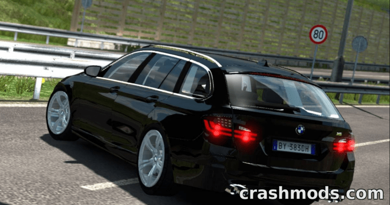 A sleek black BMW M5 Touring drives along a highway in Euro Truck Simulator 2, showcasing its detailed design.