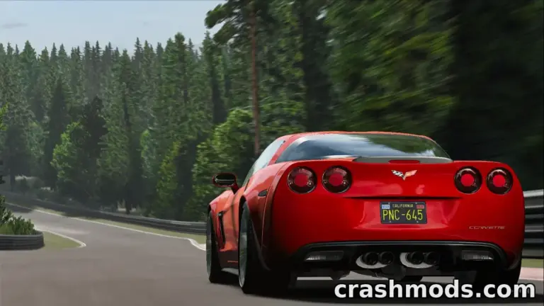 A red Chevrolet Corvette C6 speeds around a winding track, showcasing its sleek design and performance.