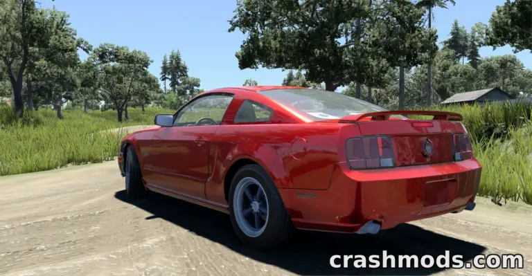 A red Ford Mustang GT (S197) drives along a dirt path, showcasing its sleek design amidst a lush green landscape.