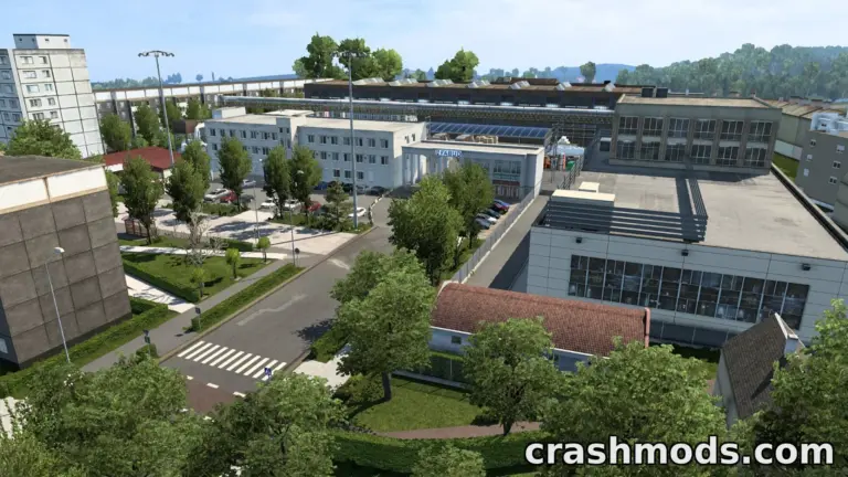 Aerial view of a detailed urban area in the "Silesia Rebuild" mod for Euro Truck Simulator 2, showcasing buildings and greenery.