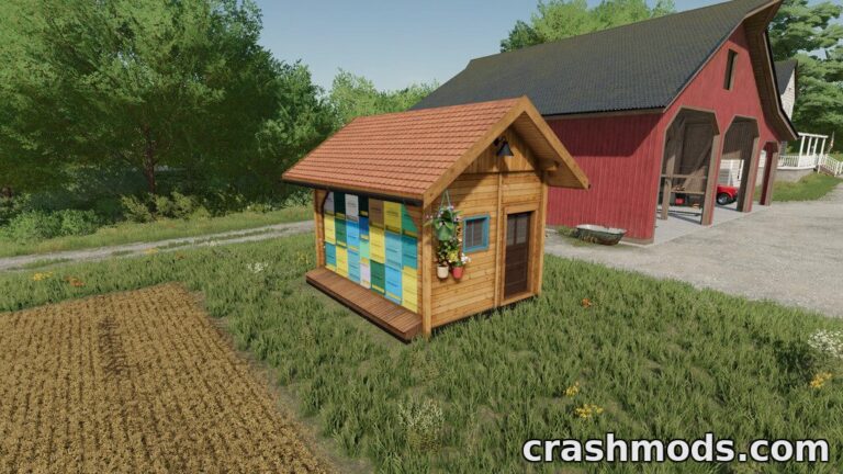 A charming wooden bee house with colorful hives sits near a farm, ready for beekeeping in Farming Simulator 22.