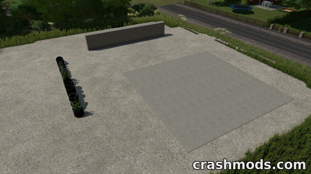 Aerial view of the Bunker Silo Kit featuring a concrete pad and tire partitions for Farming Simulator 22.