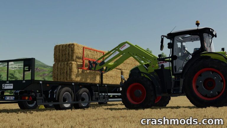 A front loader bale fork lifts hay bales onto a trailer in Farming Simulator 22, showcasing efficient farming equipment.