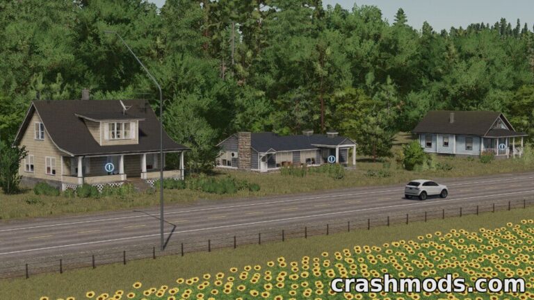 Three placeable houses line a road, surrounded by trees and sunflowers, enhancing the Farming Simulator 22 landscape.