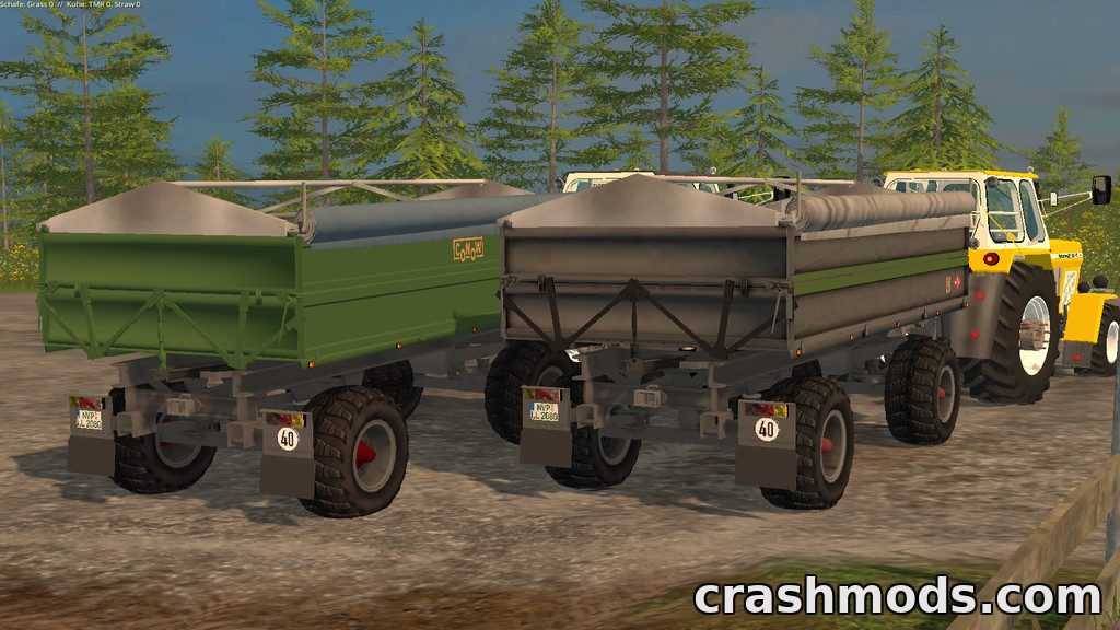 Two GDR trailers with grain and SHA bodies showcased in Farming Simulator 15, parked side by side in a forested area.