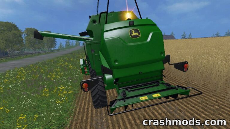 John Deere W330 compact combine harvester with a 5.7 m header working in a field during harvest season.