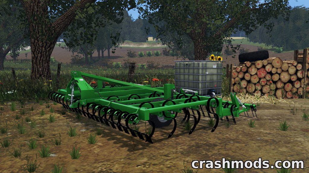 The Laumetris KLL-4 cultivator is showcased in a lush farming environment, ready for pre-sowing tillage.