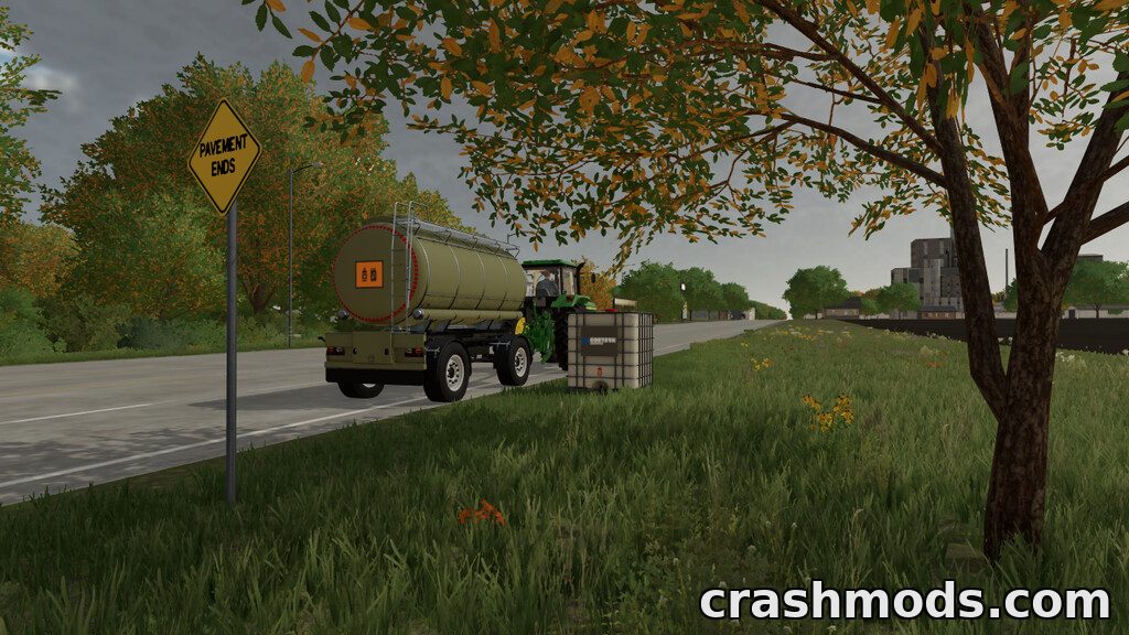 A green tank trailer is parked beside a road, ready for transporting fertilizer, diesel, milk, water, or slurry.