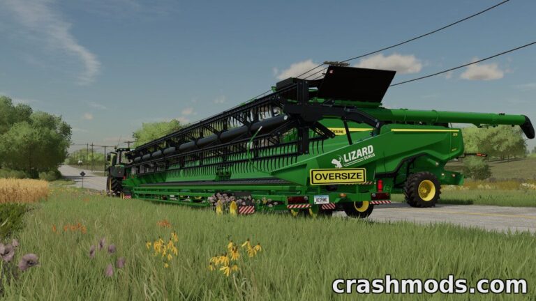 A green Lizard Durus header trailer parked beside a field in Farming Simulator 22, showcasing its oversized design.