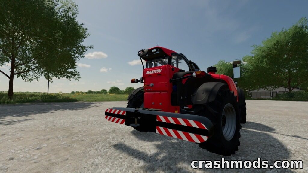 A red Manitou telehandler equipped with weights is parked on a gravel surface, surrounded by greenery.