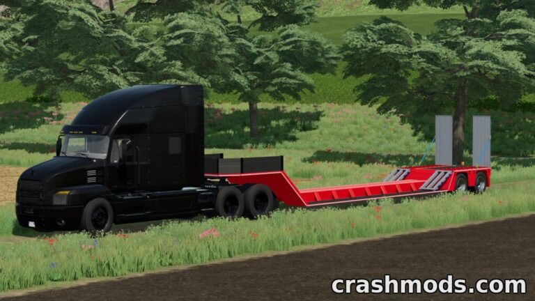 A black truck with a red forestry low loader trailer parked in a lush green field in Farming Simulator 22.