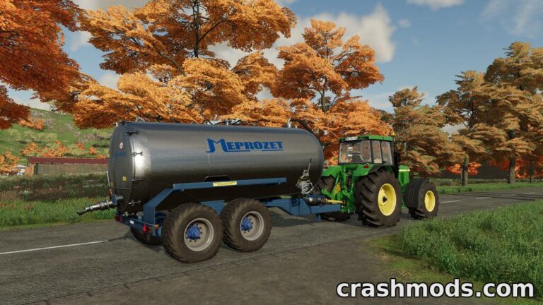 A Meprozet PN 1 14000A slurry tank is attached to a tractor, set against a vibrant autumn landscape in Farming Simulator 22.