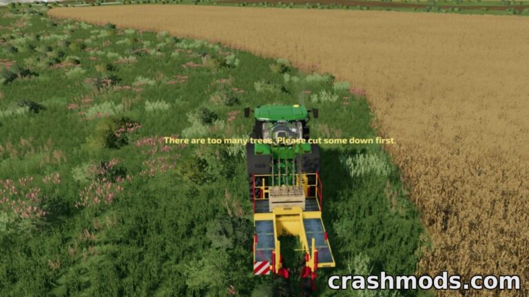 A tractor approaches a dense area of trees with a warning message about exceeding the tree limit in Farming Simulator 22.