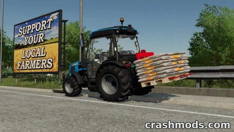 A blue tractor equipped with a pallet fork carries bags of fertilizer near a sign promoting local farmers.
