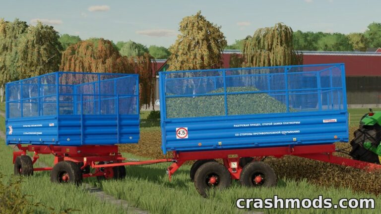 Two blue trailers from the PTS-4,5 BURLAK Pack are parked in a lush green field, ready for farming tasks.