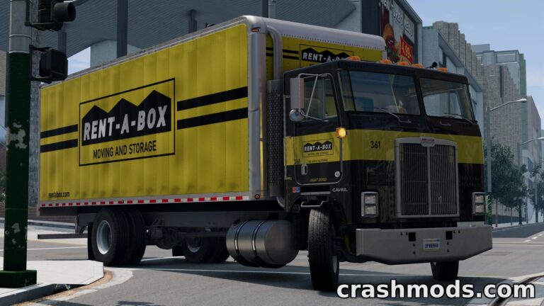 A yellow Rent-A-Box moving truck navigates a city intersection, showcasing its detailed livery in BeamNG.drive.