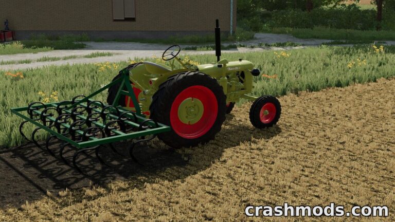 A small tractor equipped with the Sam 3M cultivator works the field, preparing soil for planting in Farming Simulator 22.