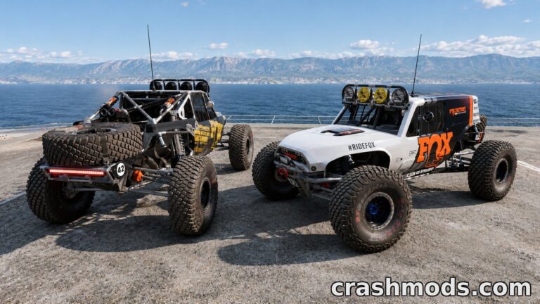 Two modified Toyota 4Runner Ultra4 4400 off-road racers showcase rugged designs by a scenic waterfront.