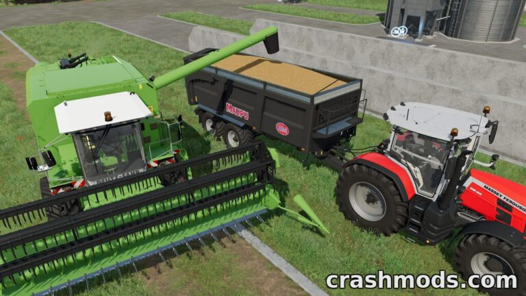A green harvester unloads grain into a black trailer while a red tractor waits nearby in Farming Simulator 22.