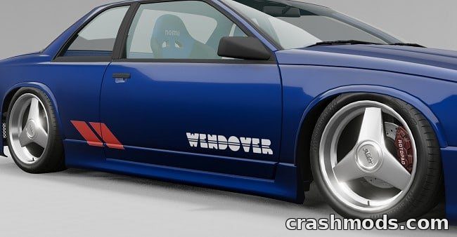 A blue car features the "Wendover" livery and large custom wheels from the Vintage Parts & Livery Wheels Pack mod.