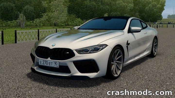 BMW M8 F92 Coupe Competition parked on a scenic road, showcasing its sleek design and luxury features.