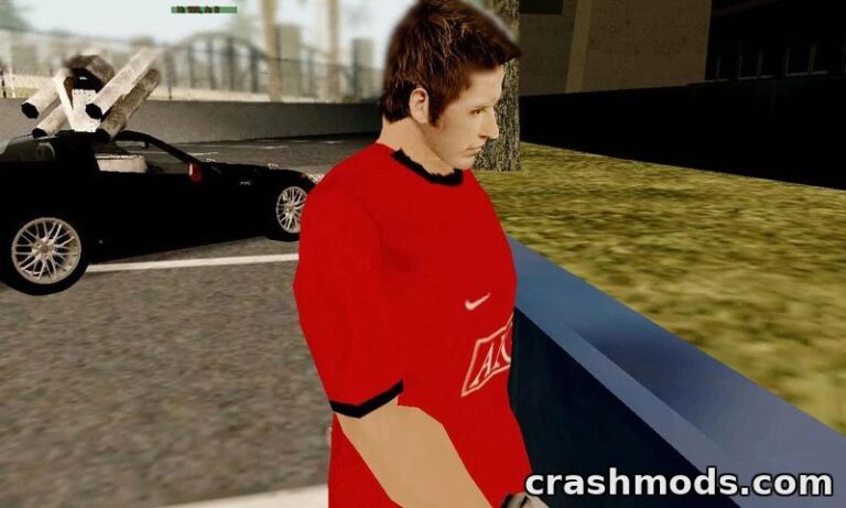Cristiano Ronaldo in a red jersey stands beside a parked car in GTA San Andreas, showcasing a detailed player skin mod.
