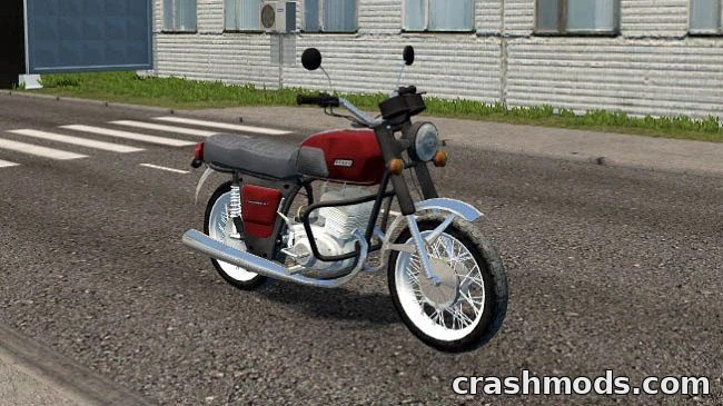 Classic Soviet IZH Jupiter 5 motorcycle parked on a city street, showcasing its retro design and urban appeal.