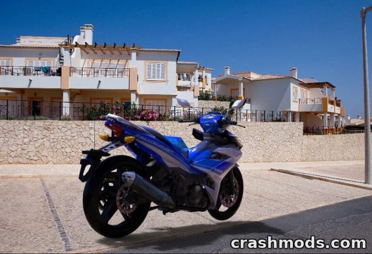 Custom Yamaha MX King 150 motorcycle parked on a sunny street, showcasing vibrant blue design against a residential backdrop.